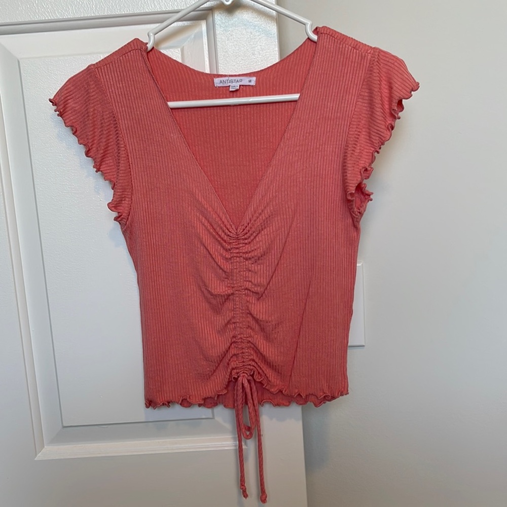 Peach/orange colored v neck crop shirt